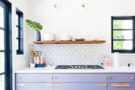 Purple Kitchen Cabinetry With Brass