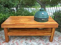 wood table with built in grill storage