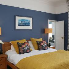 75 Yellow Bedroom With Blue Walls Ideas