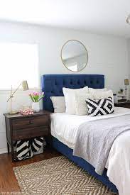 bedroom space with the navy headboard