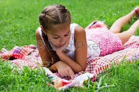 Download and use 3,000+ teen stock photos for free. Young Teen Girl Lying On Green Grass And Reading Book Stock Photo Crushpixel