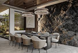 A Dining Room With A Stone Wall And A