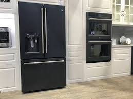 The dark hardwood floors complete the design. How To Choose The Right Appliance Finish Cnet