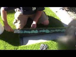 Perhaps mulch would be an option? Dyi Artificial Grass Installation On Soil Youtube