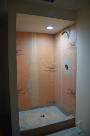 Vacuum the subfloor and check the level. How To Tile A Basement Shower The Home Depot Blog