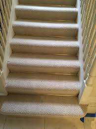 grey carpet with br stair rods to