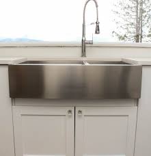 a stainless steel farmhouse style sink
