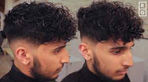 low skin fade curly haircut for men