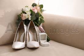 white wedding high heel shoes on sofa