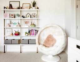 girls room with white and gold shelving