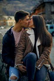 young couple kissing with eyes closed