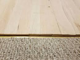 Reducer transition strips work the best to achieve an even surface between carpet and tile flooring. Flooring Threshold Transition Help Needed Please