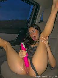 Mackenzie Jones uses a toy to pleasure her pussy in the car (6 images)