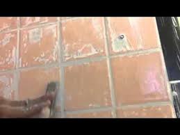 how to remove dried grout form the tile