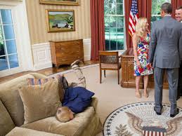 kid buries face in oval office couch as