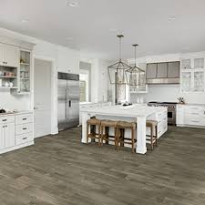 Minimal, black pendant, black leather, herringbone wood floor. Kitchen Tile Flooring Why Wood Look Is Trending Daltile