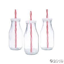 clear glass milk bottles with striped