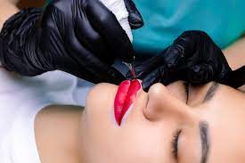 a closeup of the lip tattoo procedure