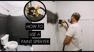 a paint sprayer on interior walls