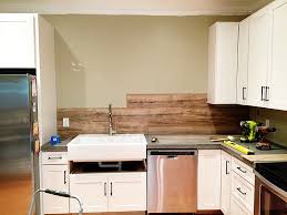 Small kitchen island with wood backsplashes. Laminate Flooring Backsplash It Looks Like Wood Bower Power
