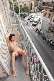 Naked on balcony