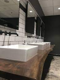 For commercial bathrooms with multiple toilet stalls and handicap the rules change a little: Commercial Restrooms 101 Dovetail Interior Design Lexington Ky