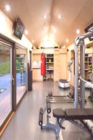 Touts vinyl flooring as the best option for a garage or basement gym. Home Gym Design Basement Home Gym Design Home Gym Design Basement Home Gym Design Home Gym De