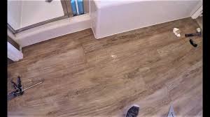 Installing vinyl plank flooring over tile is a simple way to update your bathroom. How To Install Rigid Core Vinyl Plank Floors Master Bath Closet Step By Step 101 With Gopro Youtube