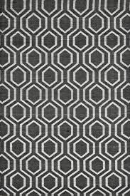 white geometric hand loom carpet