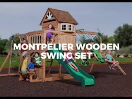 A backyard discovery children swing set featuring a fort with colorful canvas covers, 2 belt swings, a trapeze swing and a sandbox. Montpelier Wooden Swing Set For Kids From Parasol Outdoor Fruniture Dubai