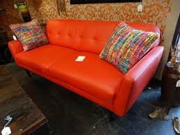 this bright red leather sofa features