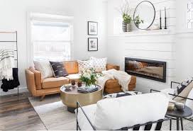 Tan Leather Couch And Shiplap Fireplace