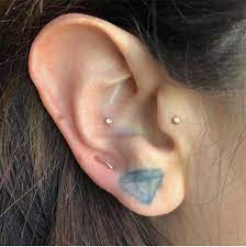 tragus piercings are everywhere right