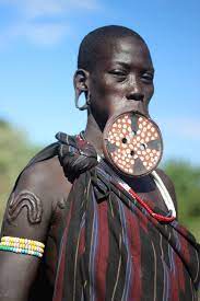 mursi women redefine beauty with clay