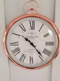 large copper pocket style wall clock