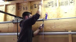 how to tighten the garage door spring