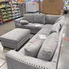 The sectional is covered in a gray colored 100% polyester fabric, that is paired with two toss pillows. Costco Buys I Am Absolutely Obsessed With This Facebook