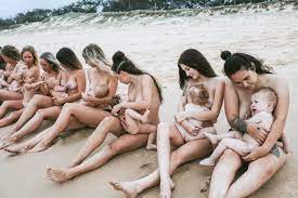 Women breast feeding naked