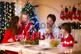 We've gone way beyond prep your holiday menu and decorate your home. these insanely fun christmas activities for families will help you turn every day of december into a bona fide winter wonderland. Stock Photos Family With Children At Christmas Dinner At Home