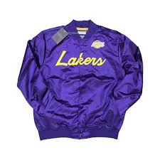 The jacket has a v neckline, elbow length sleaves with turn ups, a four button front opening and pockets on either side. Mitchell Ness Scrip Los Angeles Lakers Purple Exclusive Fitted Inc