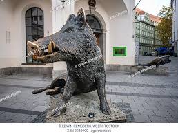 A Boar Statue With Bronze Tusk In