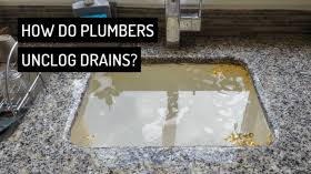 what do plumbers use to unclog drains