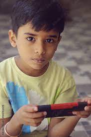 indian cute little boy with cellphone