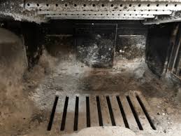 Removing Ashes From A Wood Stove The