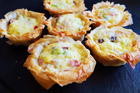 Layer up each sheet in a muffin tray. Hungry Hungry Panda Mini Ham Hock Filo Pastry Quiches