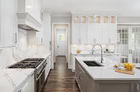 white kitchen with gray island and
