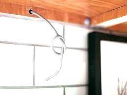 to hide under cabinet lighting wires