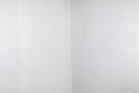 Milky White Tiles On The Bathroom Wall