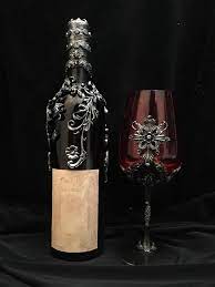 I made a bottle of Sanguis Virginis and Lady Dimitrescu's crimson glass :  r/residentevil