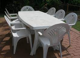 white plastic patio table and chairs